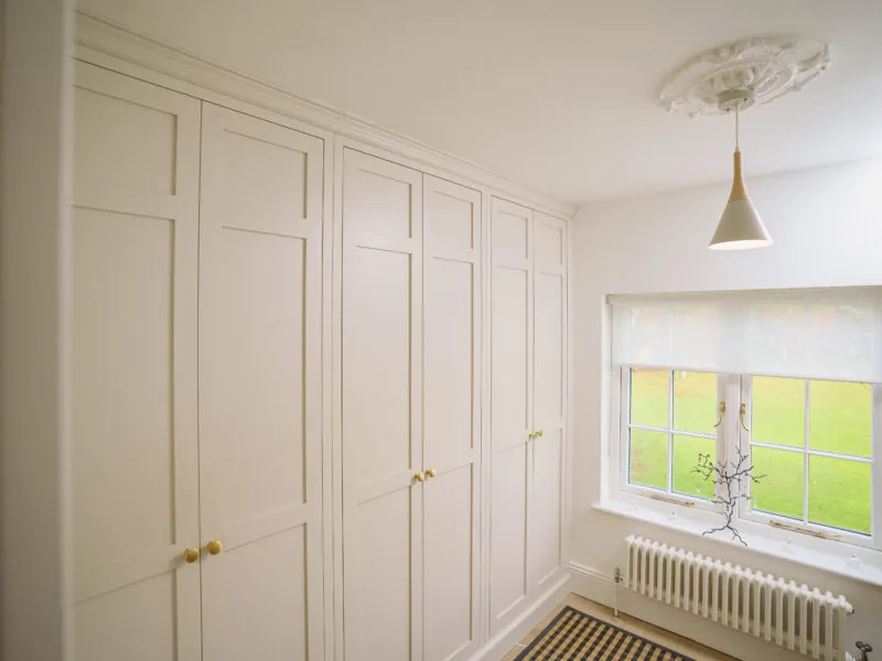 White plain wardrobe doors against a wall