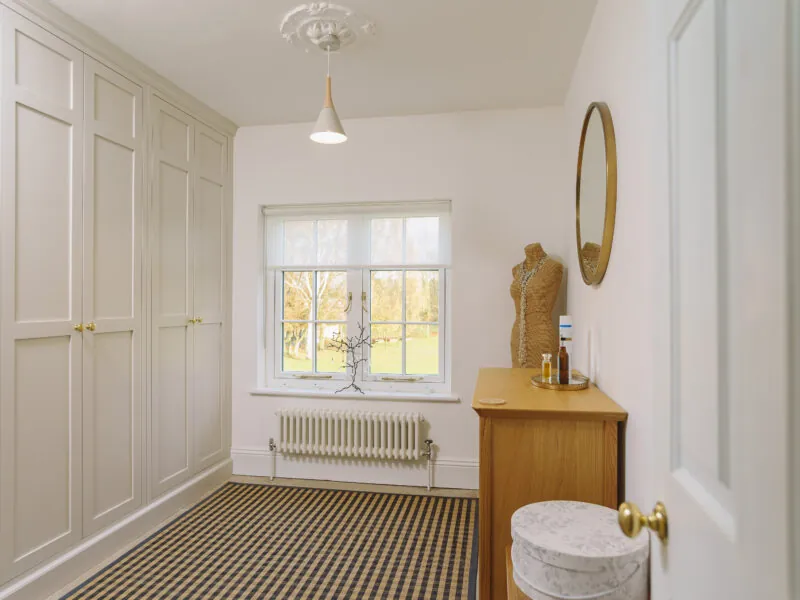 White wardrobe doors in a cottage bedroom