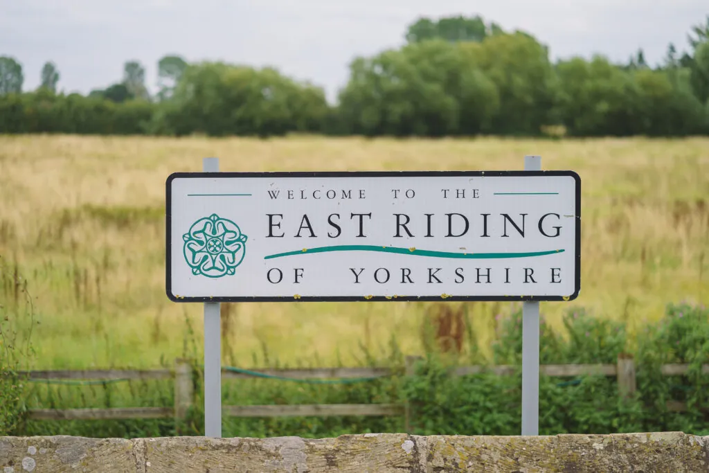 East Riding of Yorkshire roadsign in front of a field of wheat